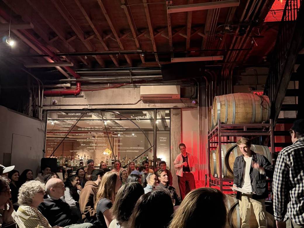 Jack Fox Baum performing on stage at a corporate event